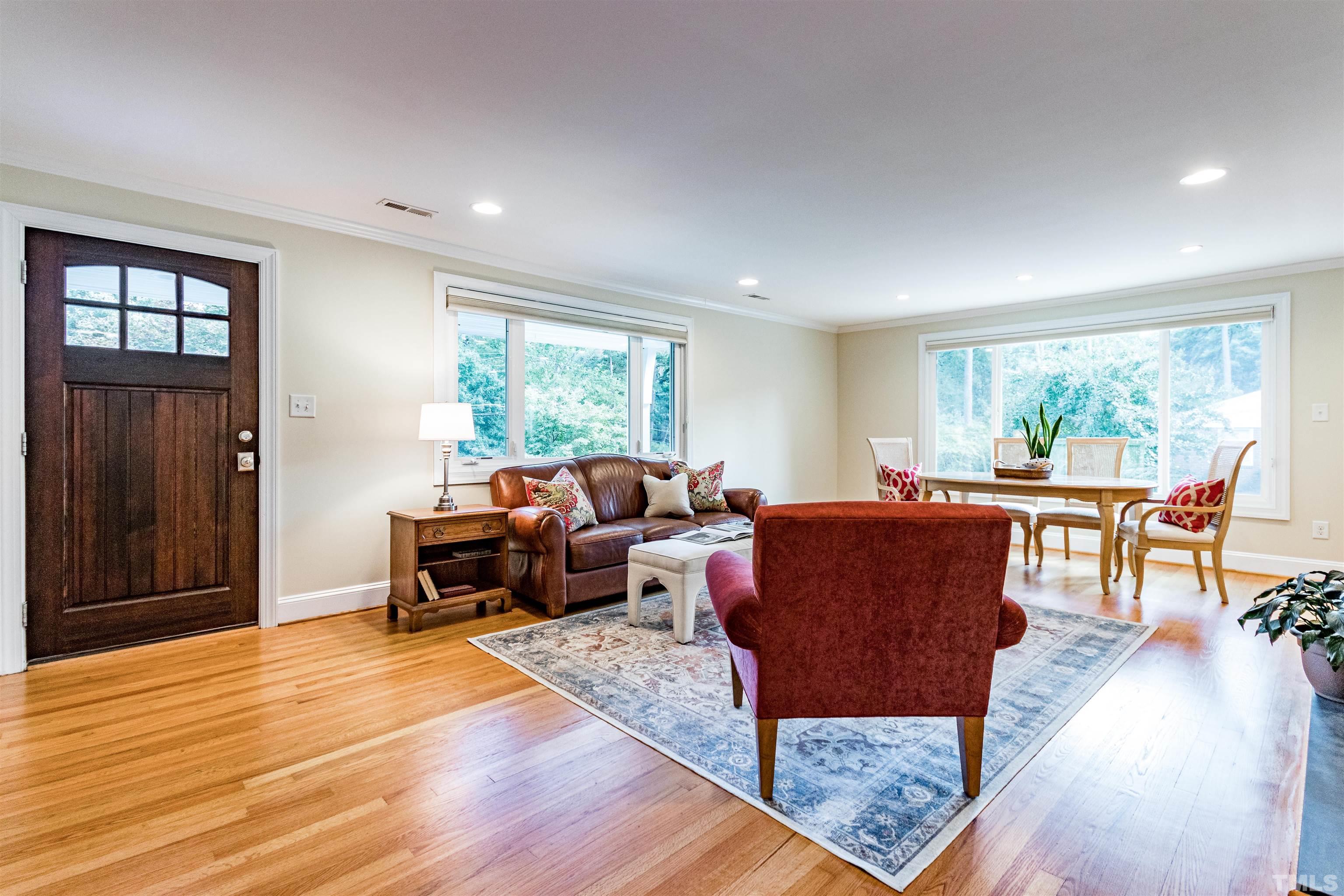 1509 Lutz Avenue Raleigh, NC 27607 - Photo 3 of 30 a living room with furniture and a wooden floor