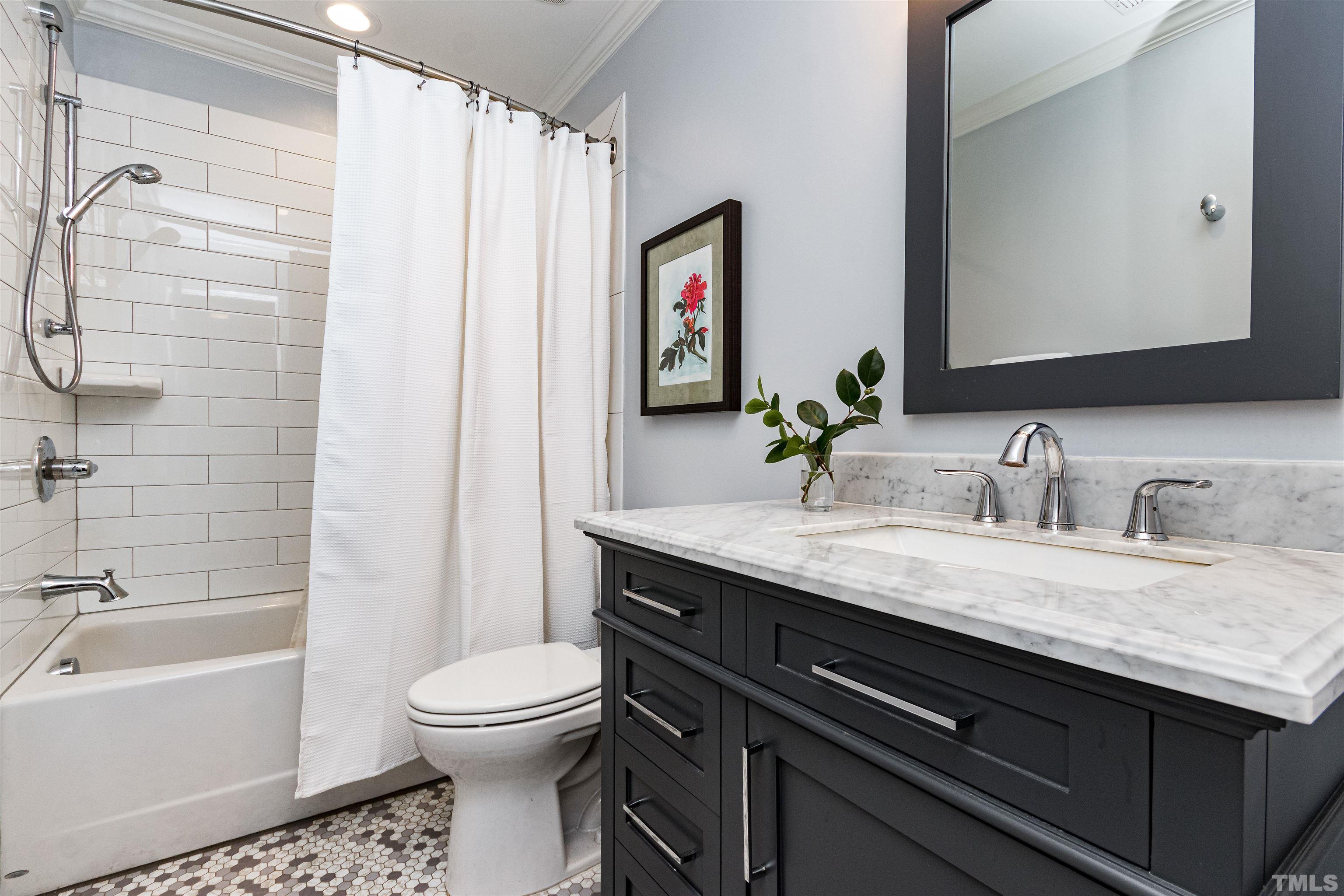 1509 Lutz Avenue Raleigh, NC 27607 - Photo 25 of 30 a bathroom with a granite countertop sink toilet and shower