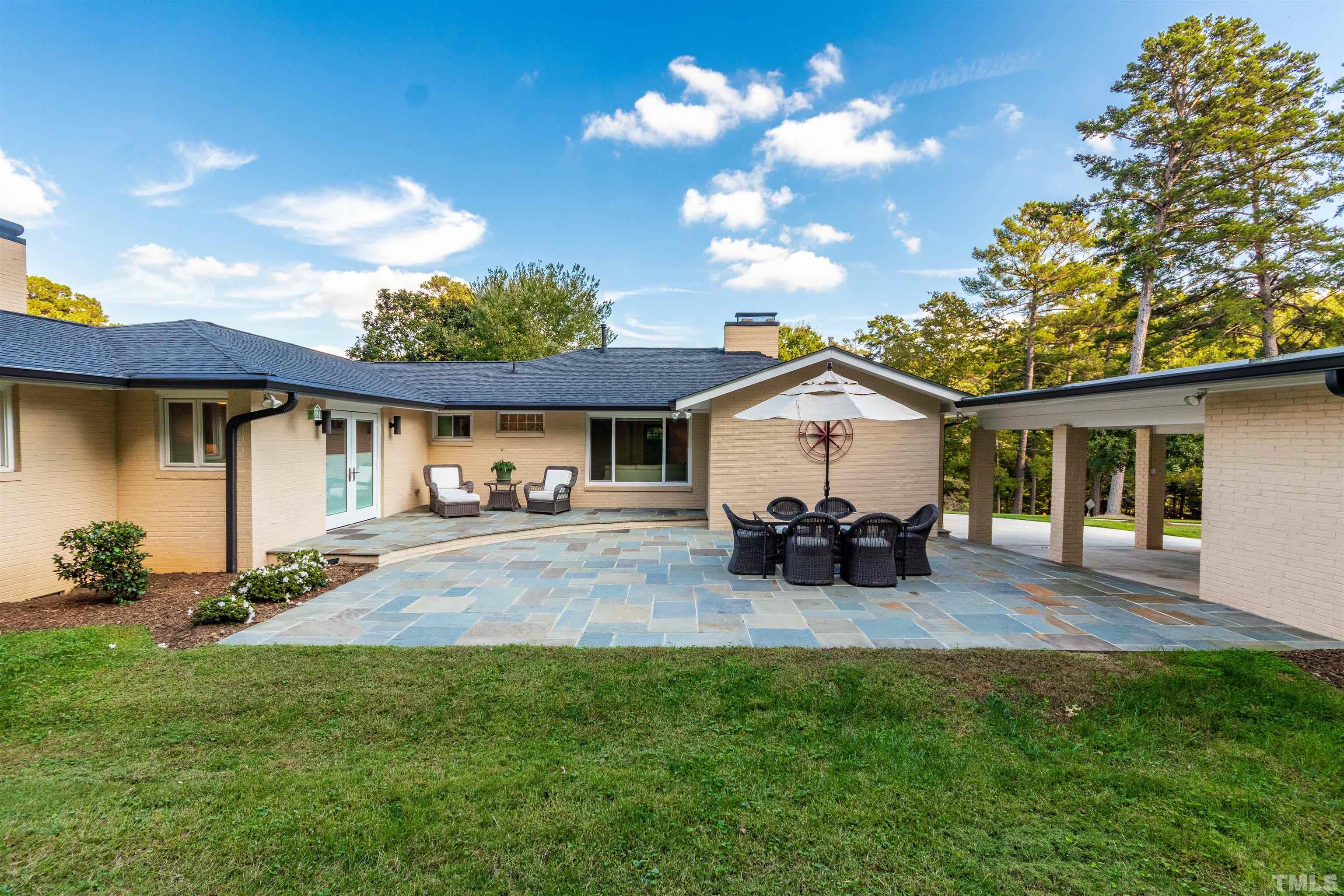 1509 Lutz Avenue Raleigh, NC 27607 - Photo 28 of 30 a view of a house with sitting area and garden