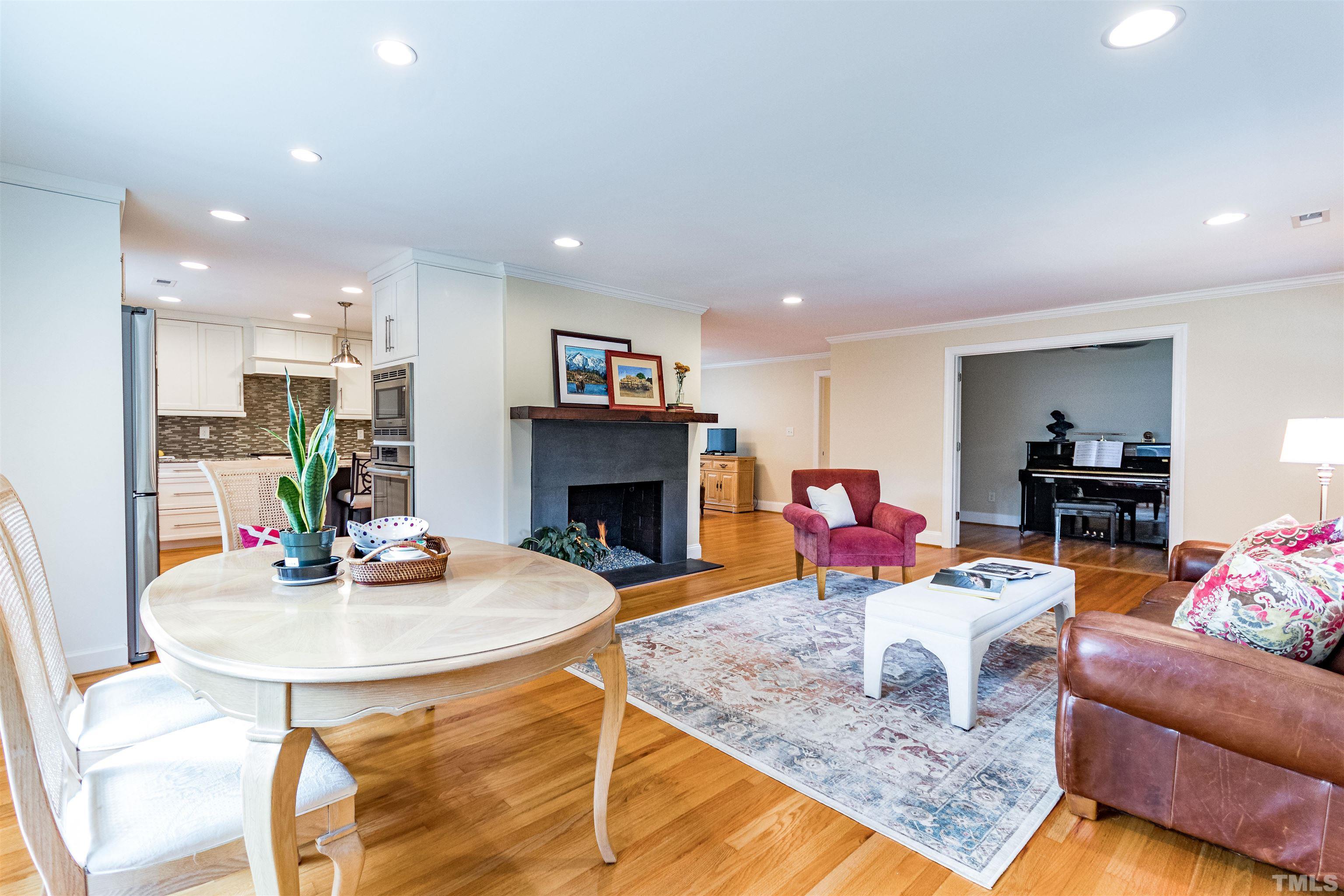1509 Lutz Avenue Raleigh, NC 27607 - Photo 5 of 30 a living room with furniture and a fireplace