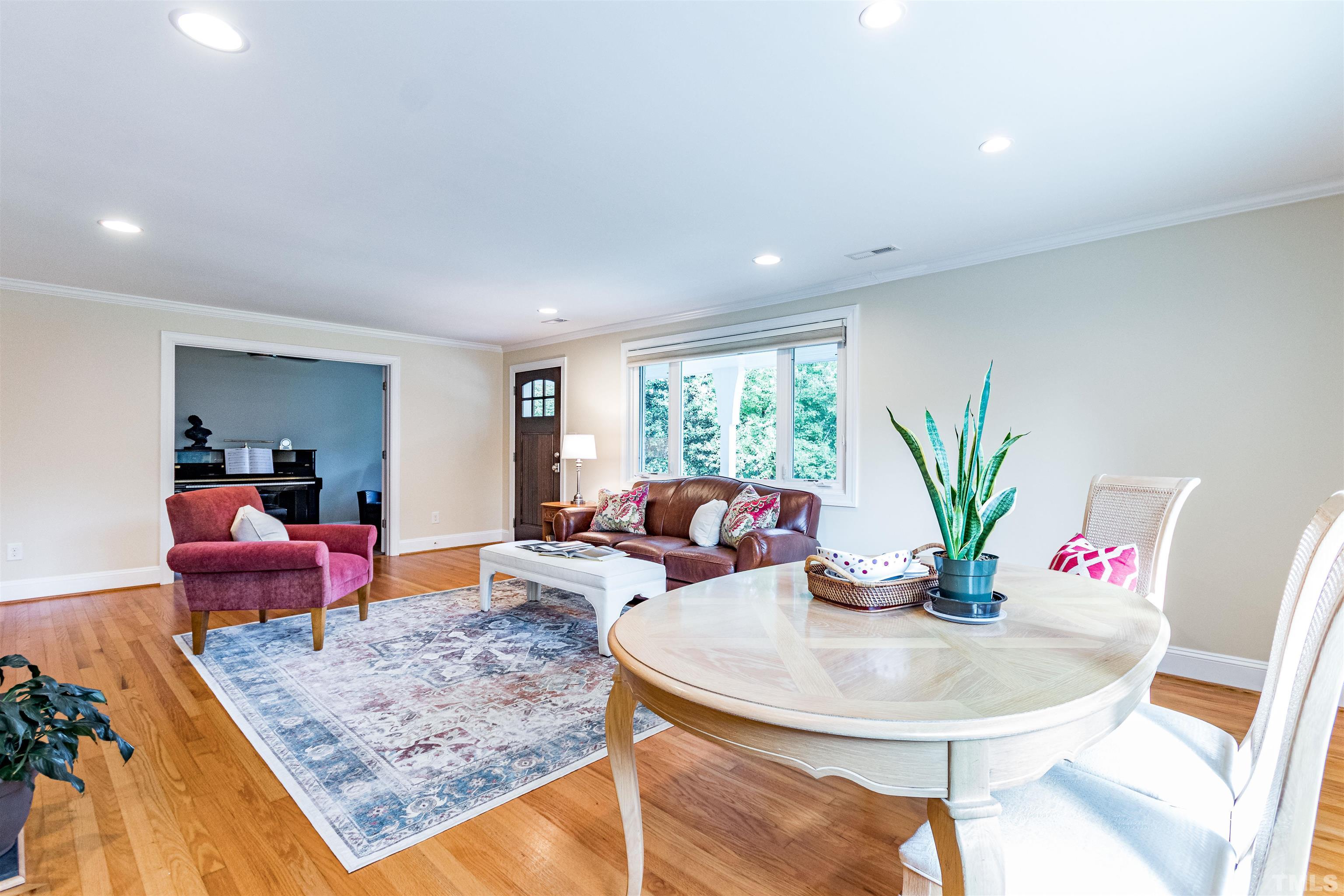 1509 Lutz Avenue Raleigh, NC 27607 - Photo 6 of 30 a living room with furniture and a potted plant