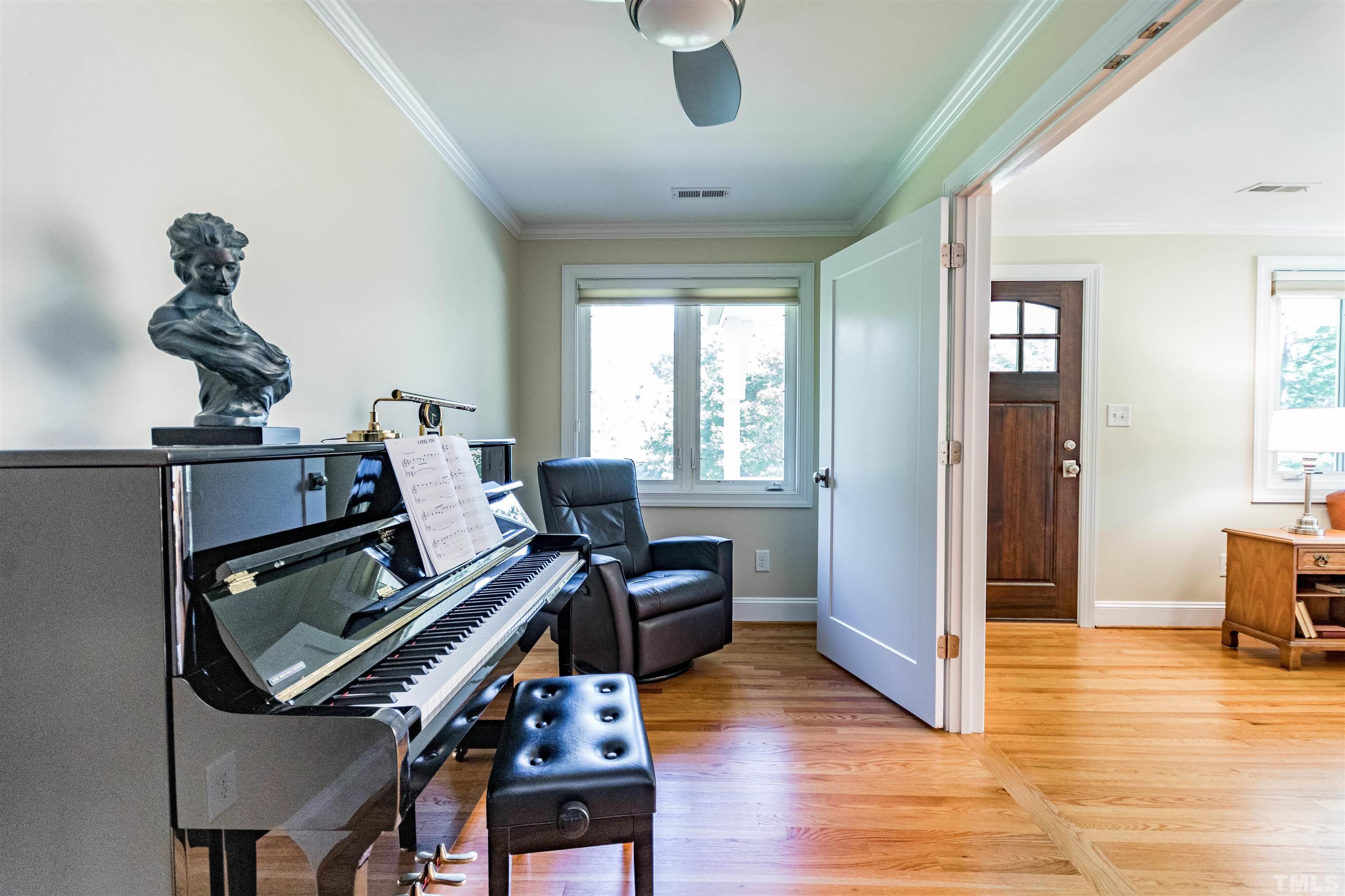 1509 Lutz Avenue Raleigh, NC 27607 - Photo 7 of 30 a living room with furniture and a wooden floor