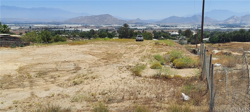 0 Darin Perris Ca Perris, CA 92570 - Photo 1 of 17 a view of a backyard of a house with a mountain