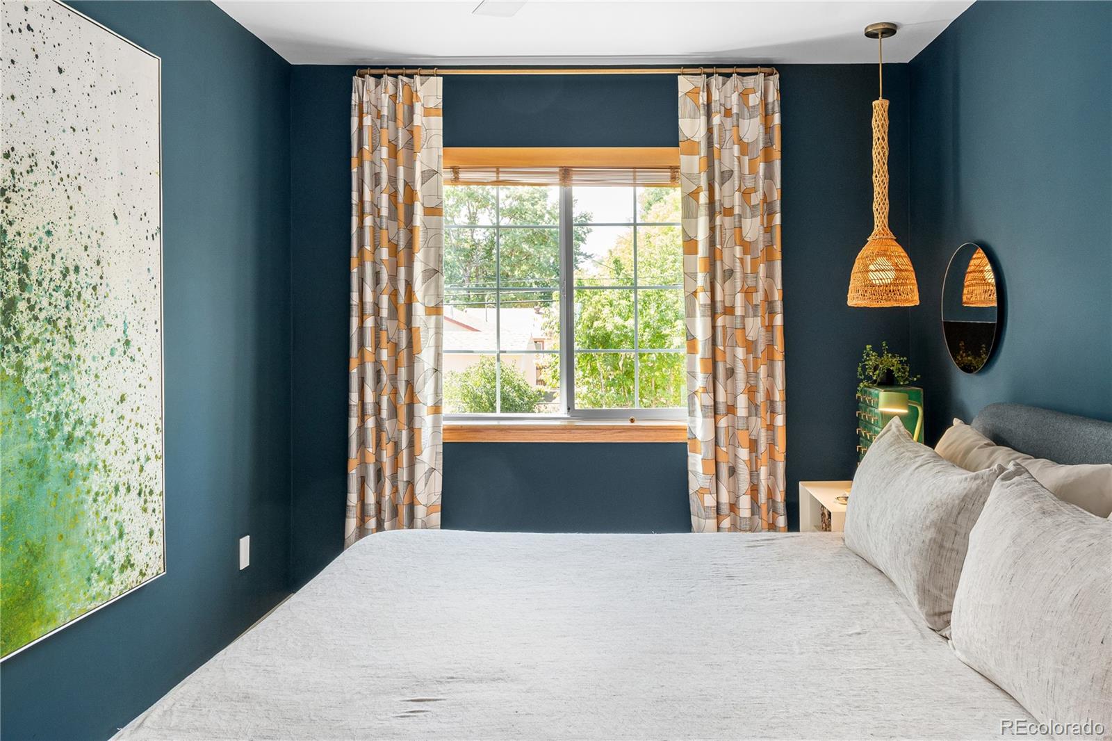 4225 Balsam Street Wheat Ridge, CO 80033 - Photo 18 of 33 a bedroom with a bed and a large window