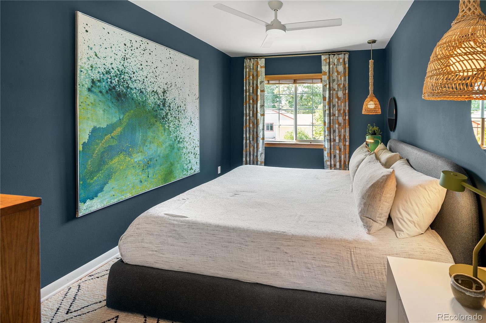 4225 Balsam Street Wheat Ridge, CO 80033 - Photo 19 of 33 a bedroom with a bed and window