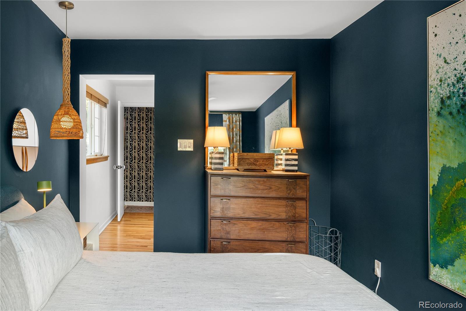 4225 Balsam Street Wheat Ridge, CO 80033 - Photo 20 of 33 a bedroom with a bed and a potted plant