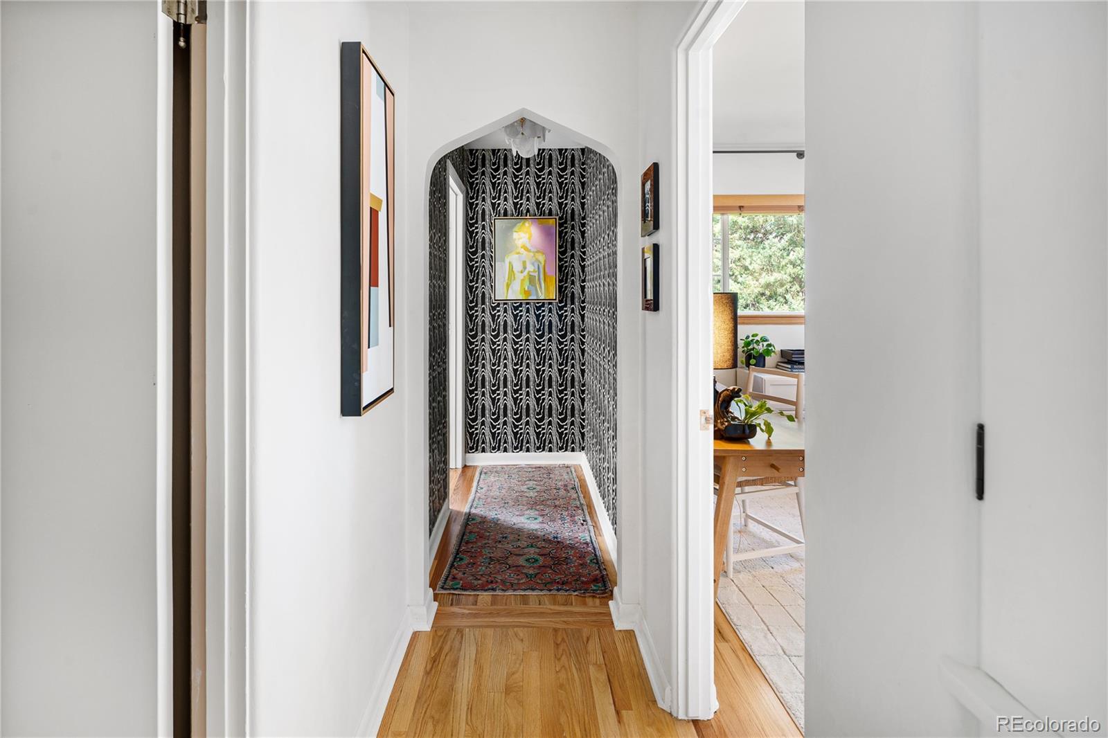 4225 Balsam Street Wheat Ridge, CO 80033 - Photo 22 of 33 a view of a hallway with wooden floor and staircase