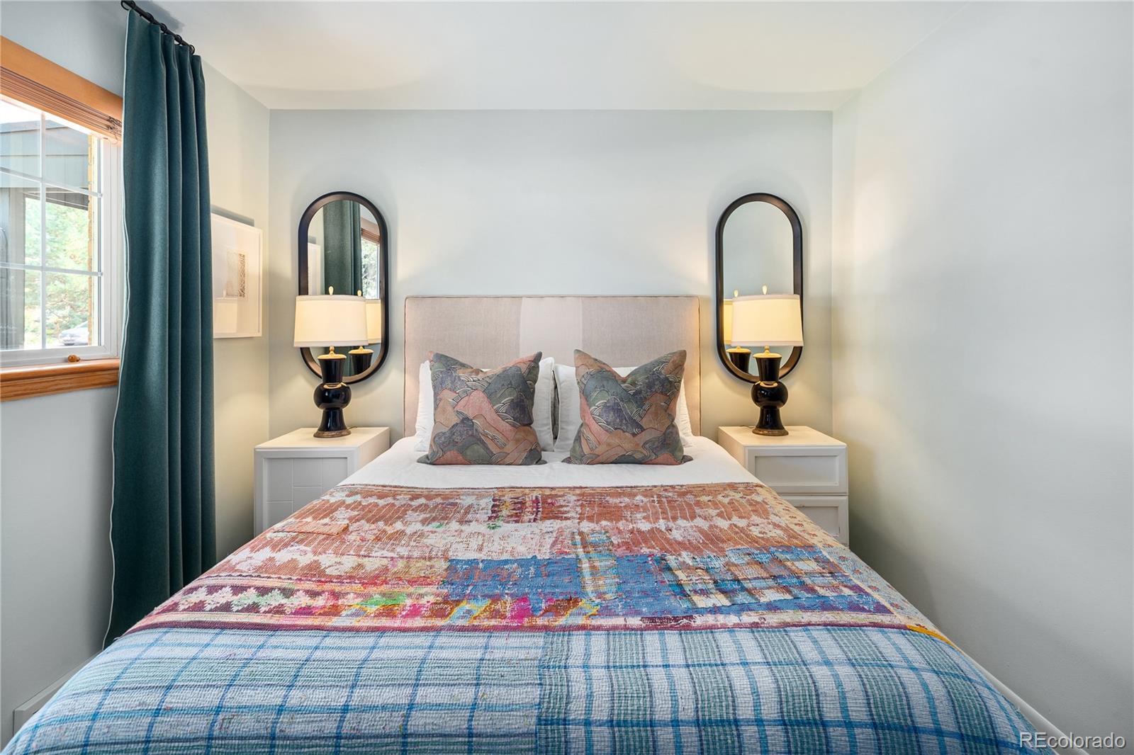 4225 Balsam Street Wheat Ridge, CO 80033 - Photo 23 of 33 a bedroom with a bed and window