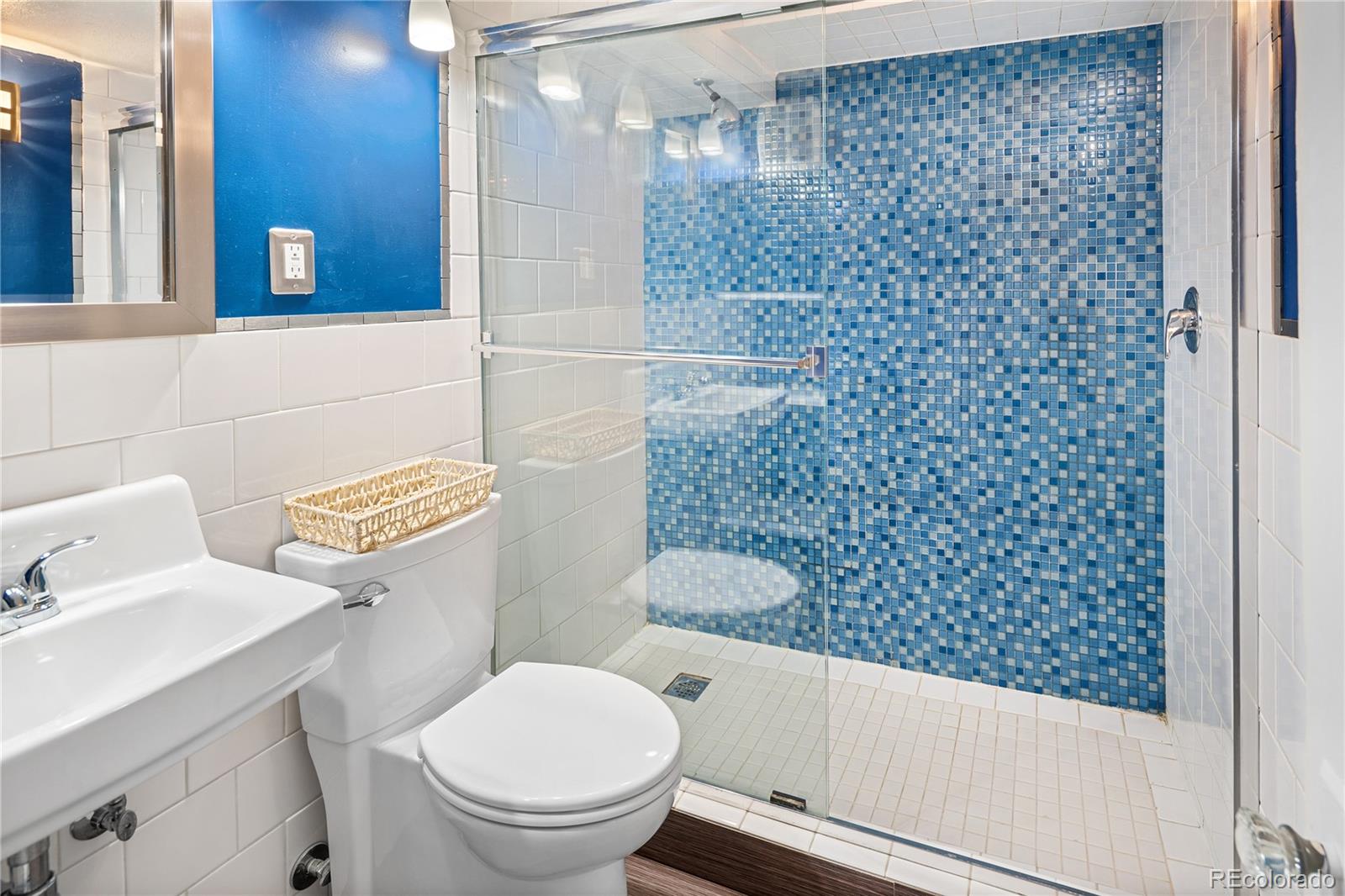 4225 Balsam Street Wheat Ridge, CO 80033 - Photo 28 of 33 a bathroom with a toilet and a sink