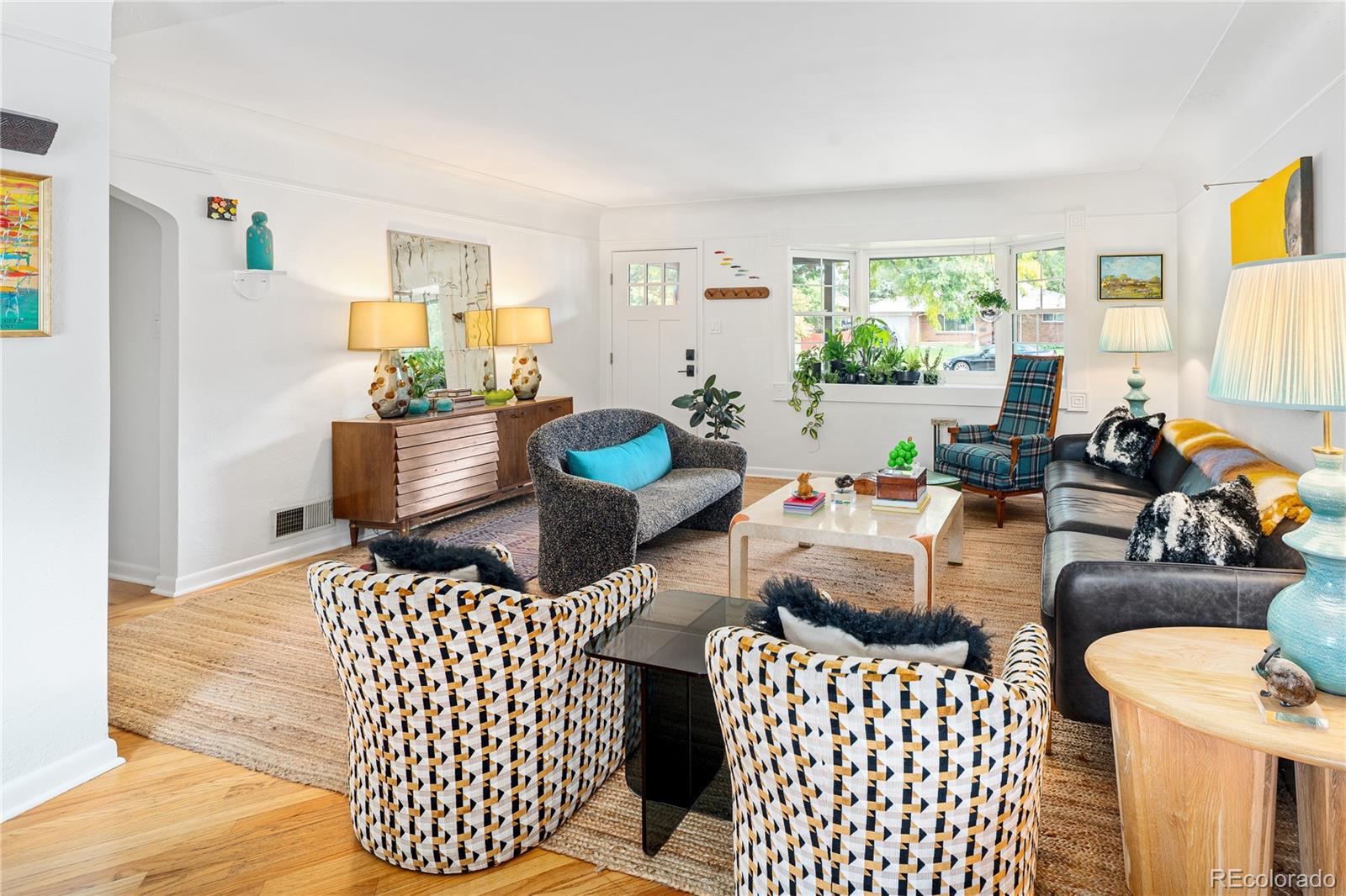 4225 Balsam Street Wheat Ridge, CO 80033 - Photo 6 of 33 a living room with furniture and a large window