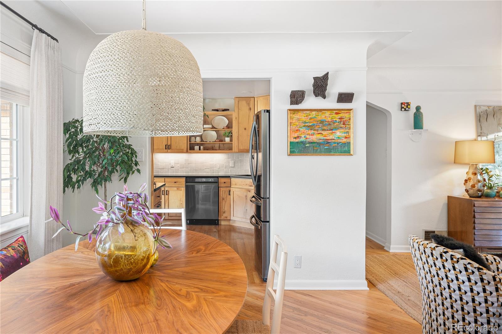 4225 Balsam Street Wheat Ridge, CO 80033 - Photo 8 of 33 a dining room with furniture and wooden floor