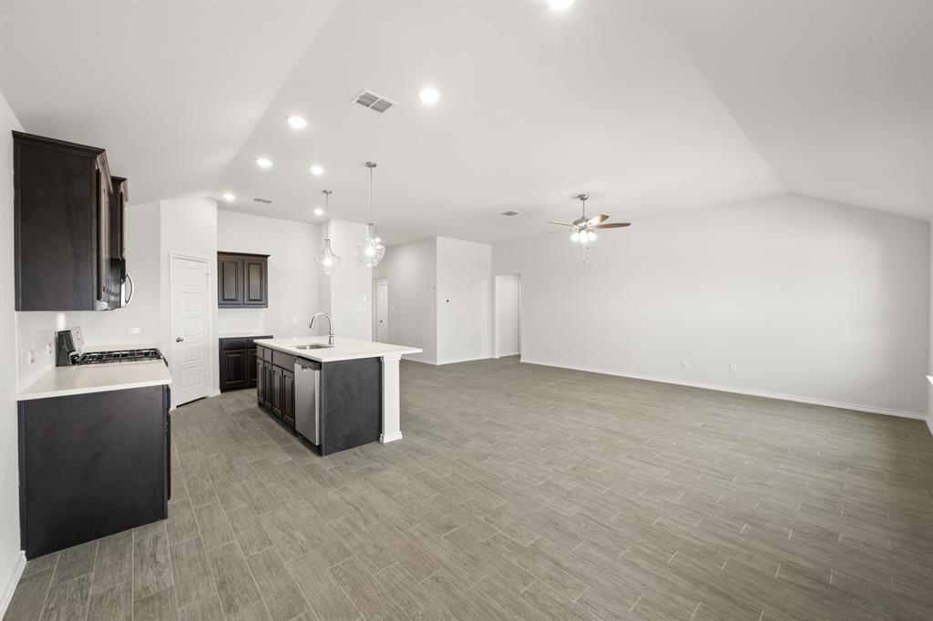 1908 Seminole Drive Cleburne, TX 76033 - Photo 14 of 27 a living room with kitchen furniture and a flat screen tv