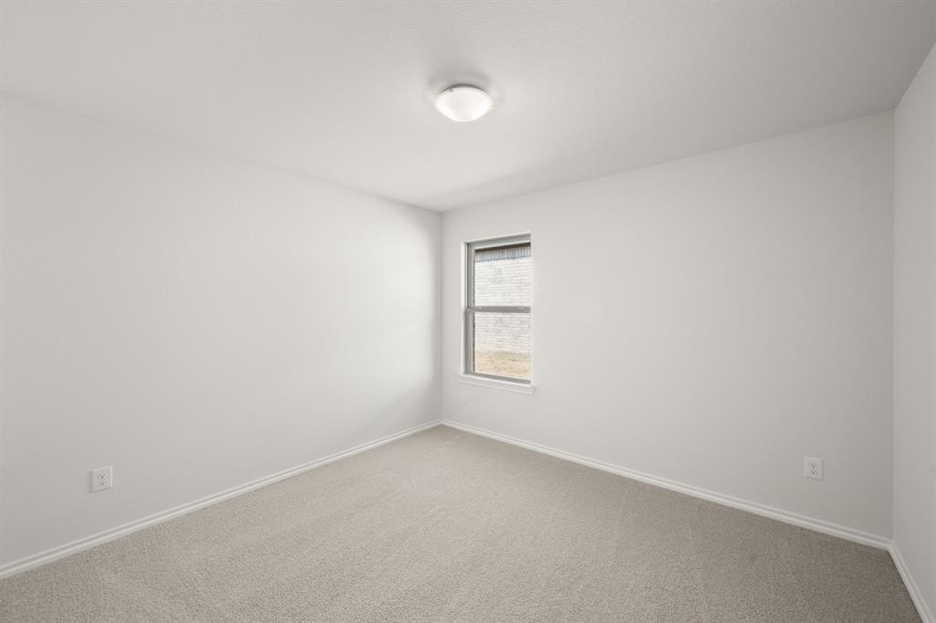 1908 Seminole Drive Cleburne, TX 76033 - Photo 16 of 27 a view of an empty room and window