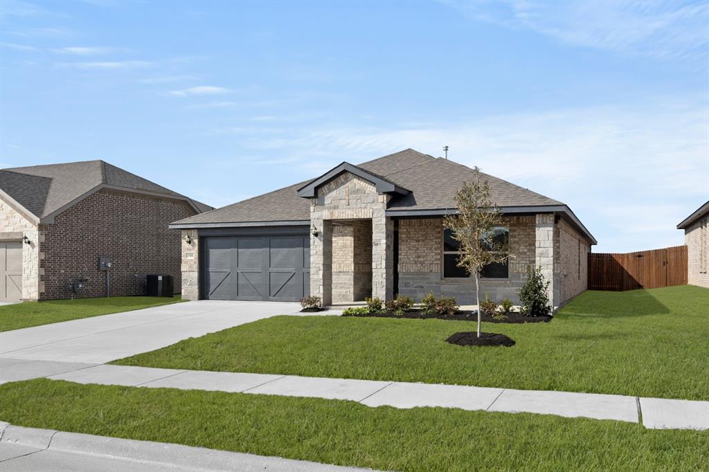 1908 Seminole Drive Cleburne, TX 76033 - Photo 2 of 27 a front view of a house with a yard and trees