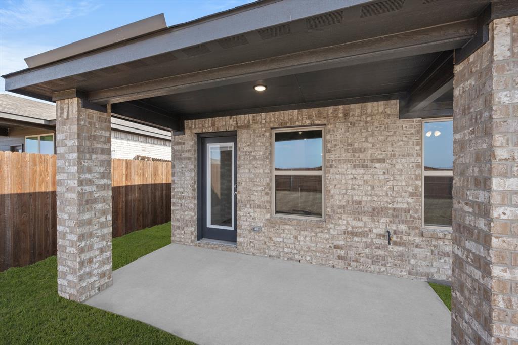 1908 Seminole Drive Cleburne, TX 76033 - Photo 27 of 27 a front view of a house with a yard