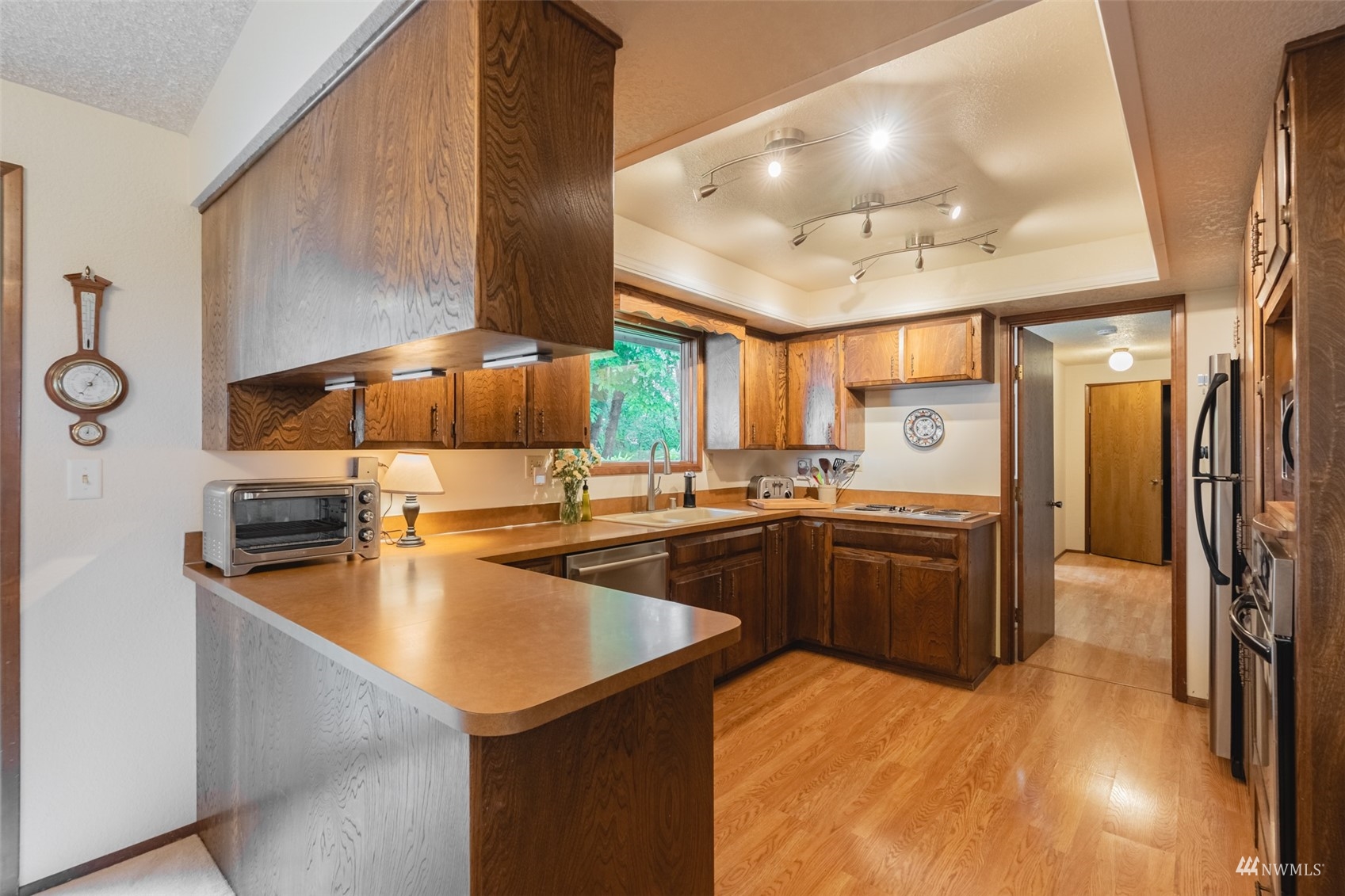 521 West Wiser Lake Road Ferndale, WA 98248 - Photo 6 of 38 a kitchen with stainless steel appliances granite countertop a sink a stove and a refrigerator