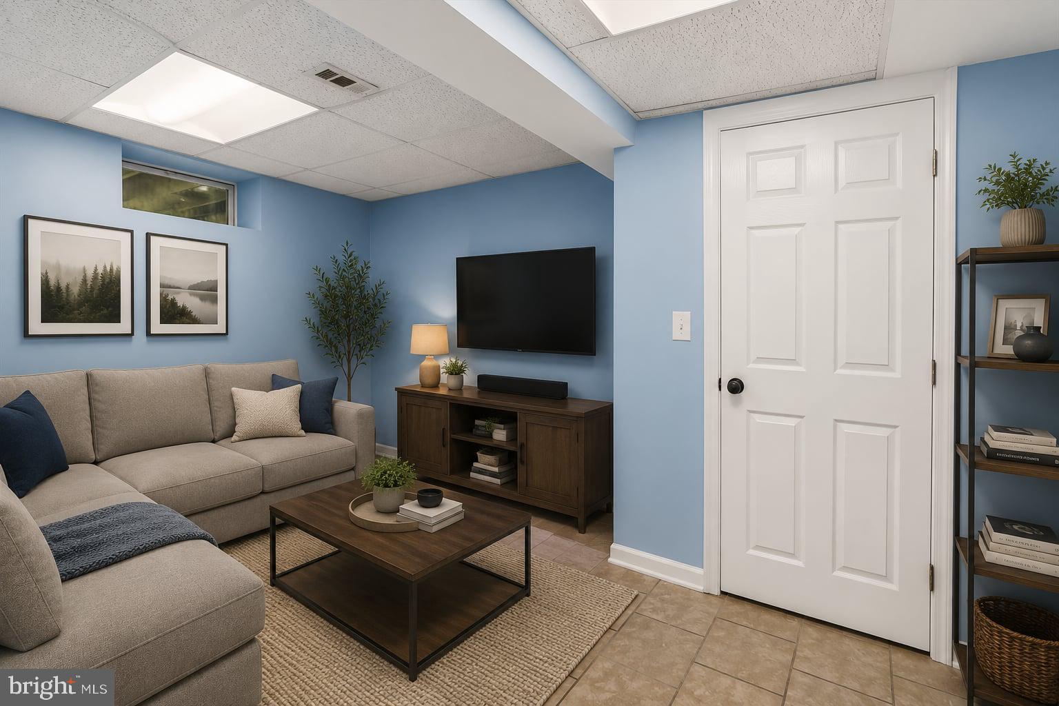 321 North 3rd Street Oakland, MD 21550 - Photo 32 of 48 a living room with furniture a rug and a flat screen tv