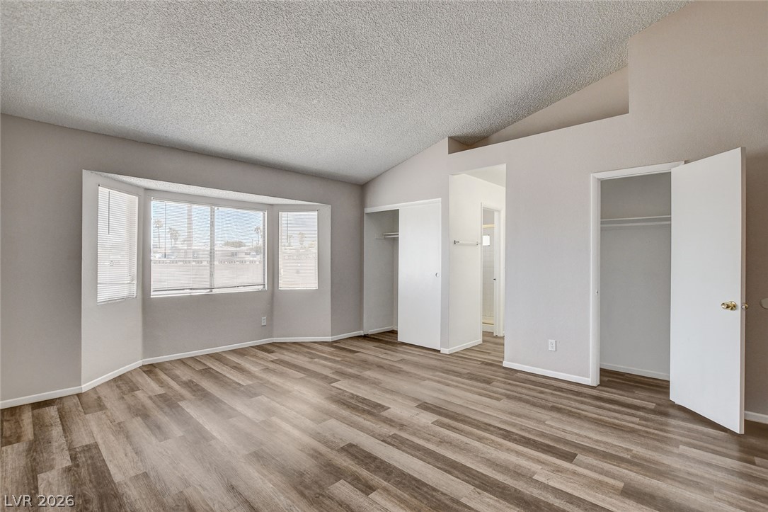 6209 Warm River Road Las Vegas, NV 89108 - Photo 27 of 39 A generous primary bedroom with a broad bay window, offering tranquil views.