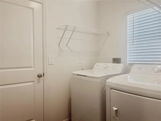 a bathroom with a shower and a glass door
