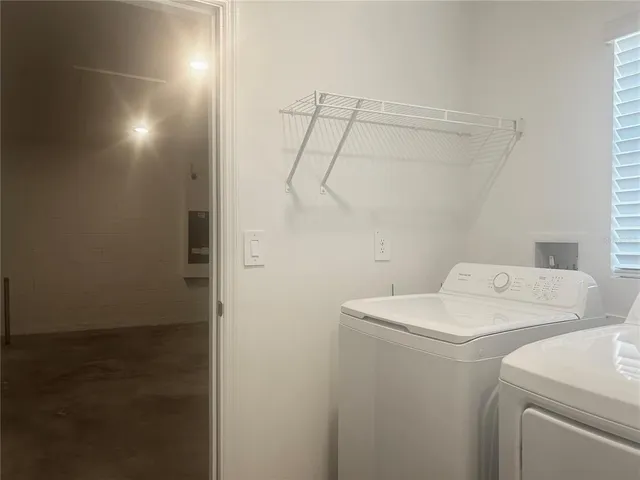 a kitchen with stainless steel appliances granite countertop a sink a stove and cabinets