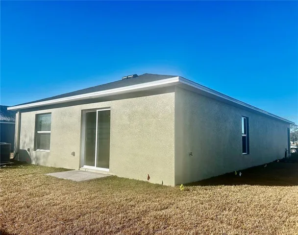 a view of hallway with wooden floor