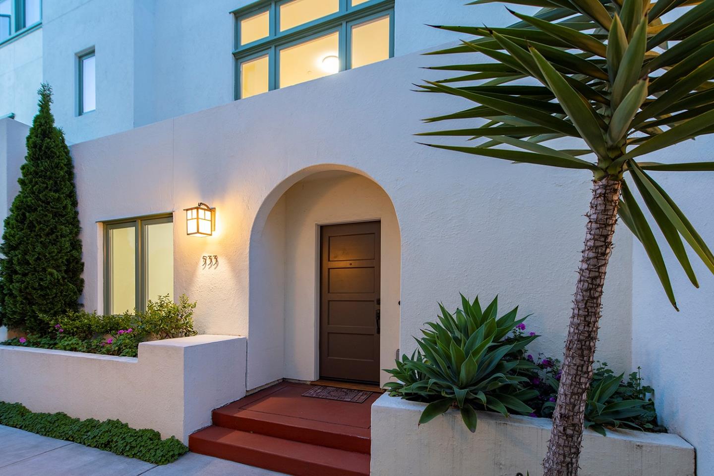 a front view of a house with a yard