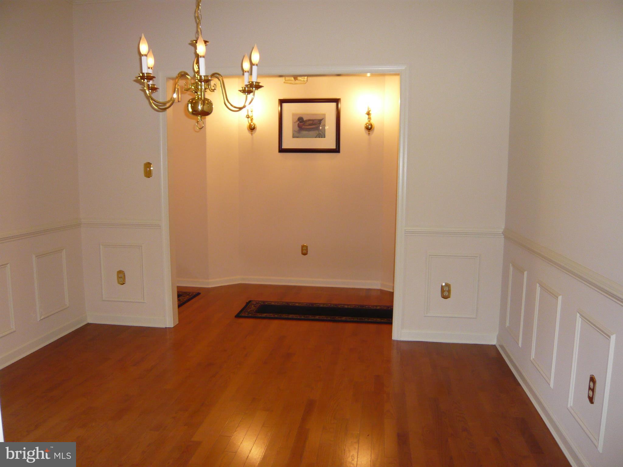 Formal dining room with hardwood floor