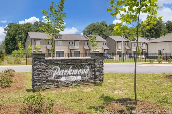 a swimming pool with outdoor seating and yard