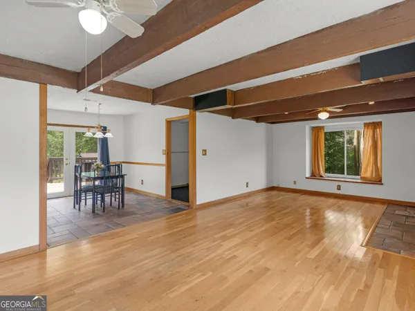 a view of a livingroom with furniture and a table