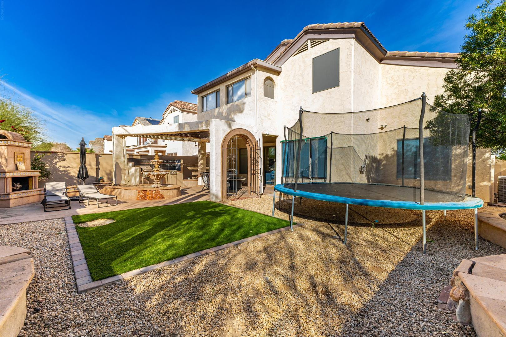 2707 West Lamar Road Phoenix, AZ 85017 - Photo 32 of 44 a front view of a house with a yard table and chairs