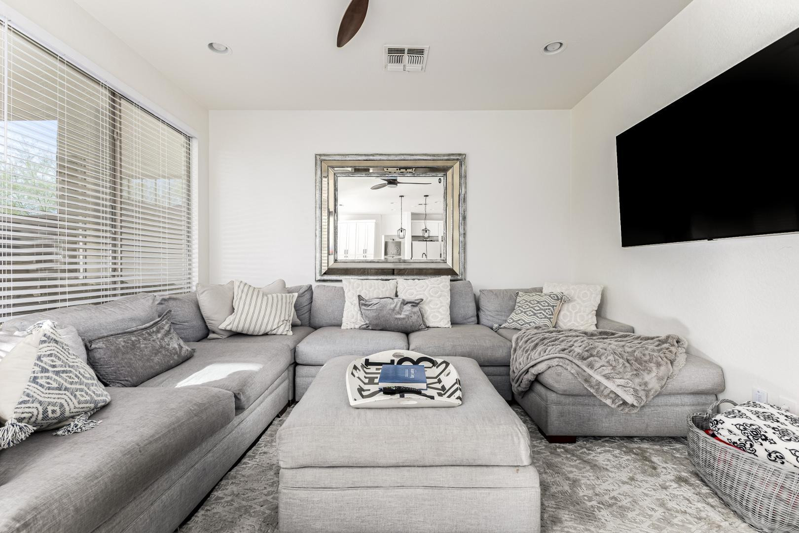 2707 West Lamar Road Phoenix, AZ 85017 - Photo 7 of 44 a living room with furniture and a flat screen tv