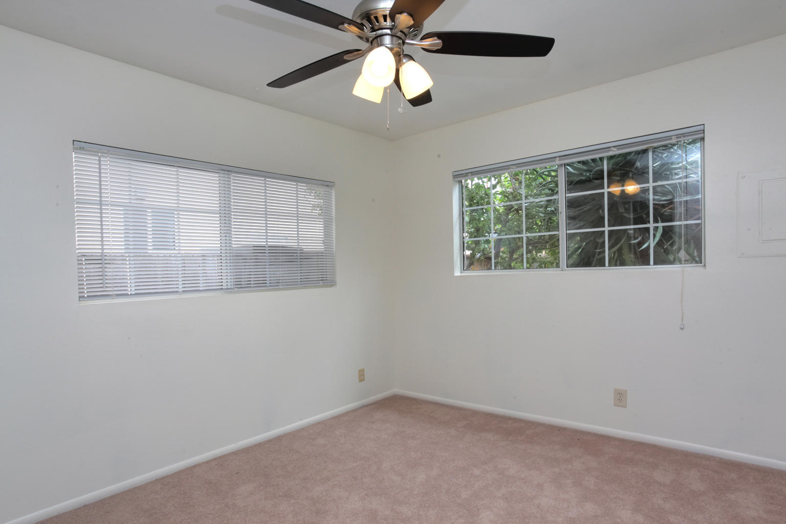 1035 Cramer Road, Unit B Carpinteria, CA 93013 - Photo 12 of 12 an empty room with a window and a fan