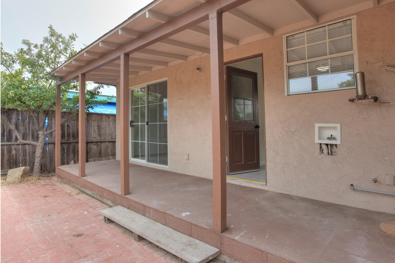 1035 Cramer Road, Unit B Carpinteria, CA 93013 - Photo 7 of 12 a backyard of a house with table and chairs