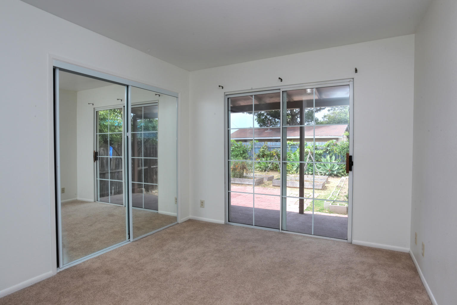1035 Cramer Road, Unit B Carpinteria, CA 93013 - Photo 9 of 12 a view of empty room with windows and refrigerator