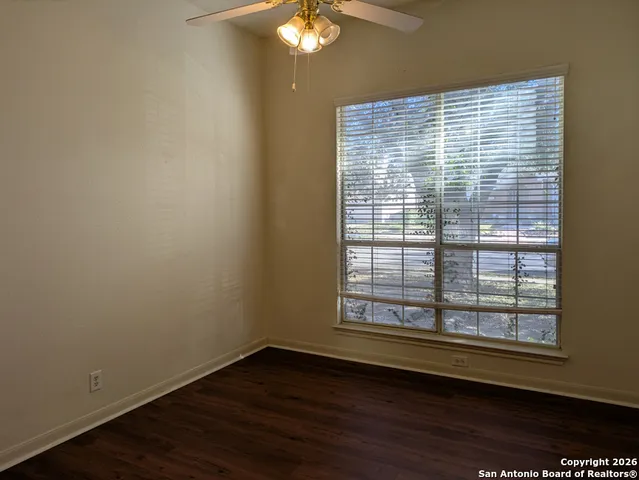 an empty room with wooden floor