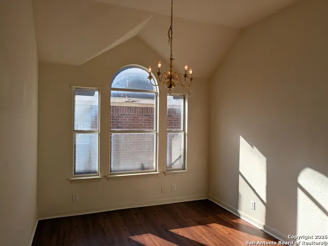 a view of a livingroom with furniture window and wooden floor