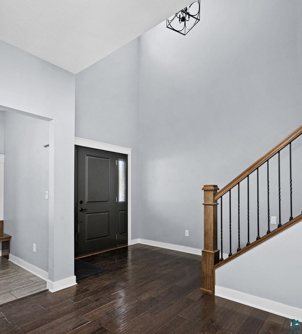 3879 Okerstrom Road Hermantown, MN 55811 - Photo 3 of 32 Entryway with dark wood finished floors and lofted ceiling