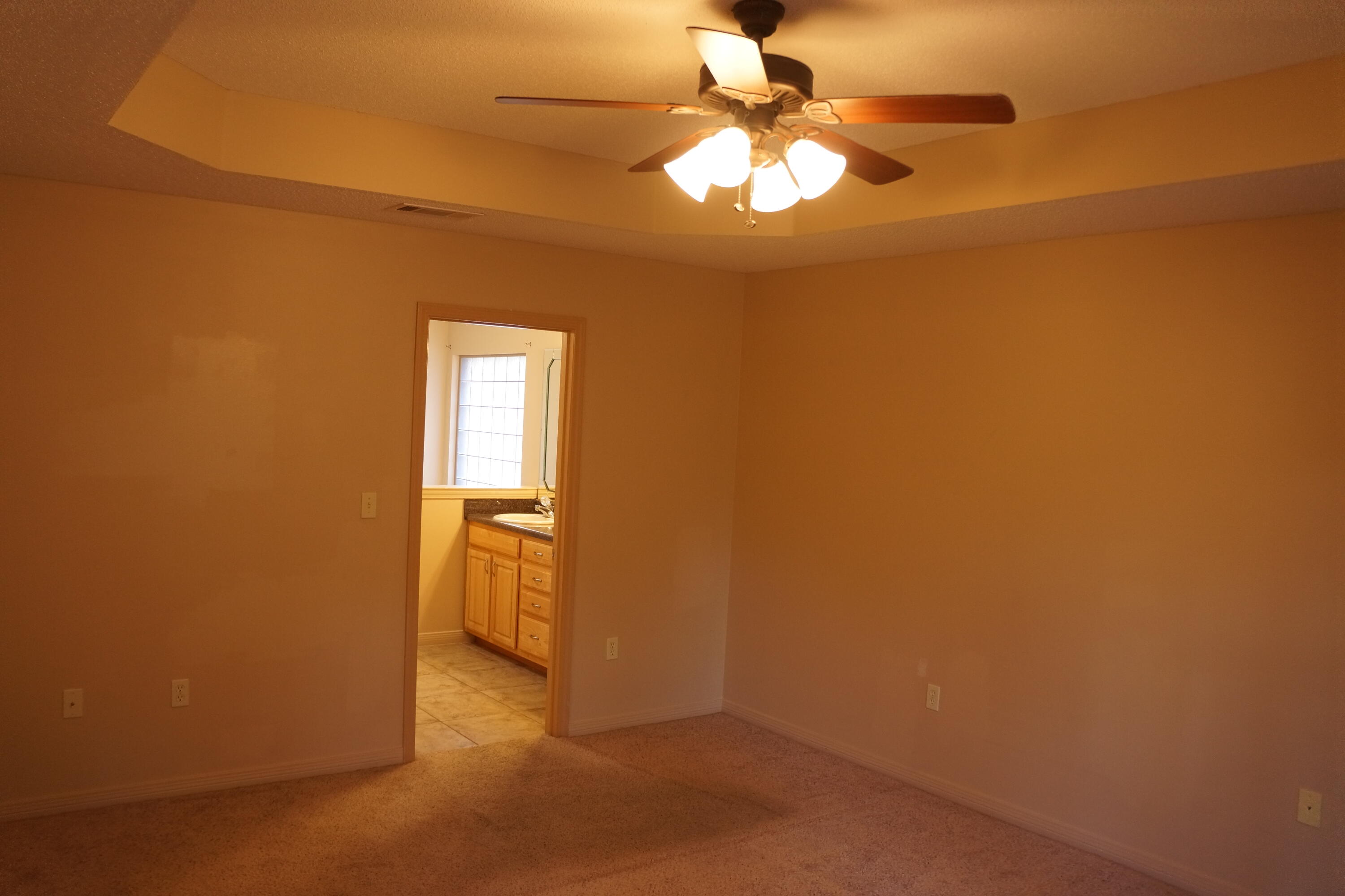 3248 Twilight Drive Crestview, FL 32539 - Photo 9 of 13 an empty room with a chandelier fan