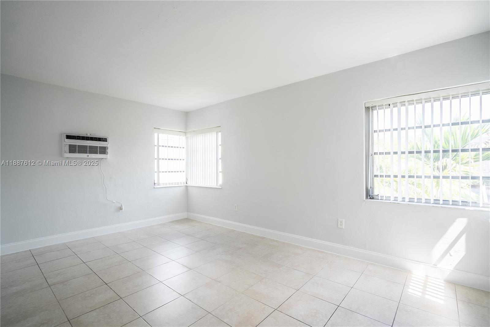 8300 Abbott Avenue, Unit 17 Miami Beach, FL 33141 - Photo 8 of 16 a view of empty room with windows