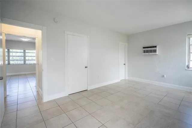 a view of an empty room and window