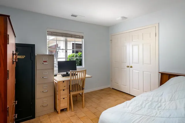 a kitchen with granite countertop a stove top oven a sink dishwasher and a refrigerator