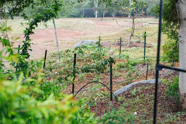 a view of a house with swimming pool and sitting area