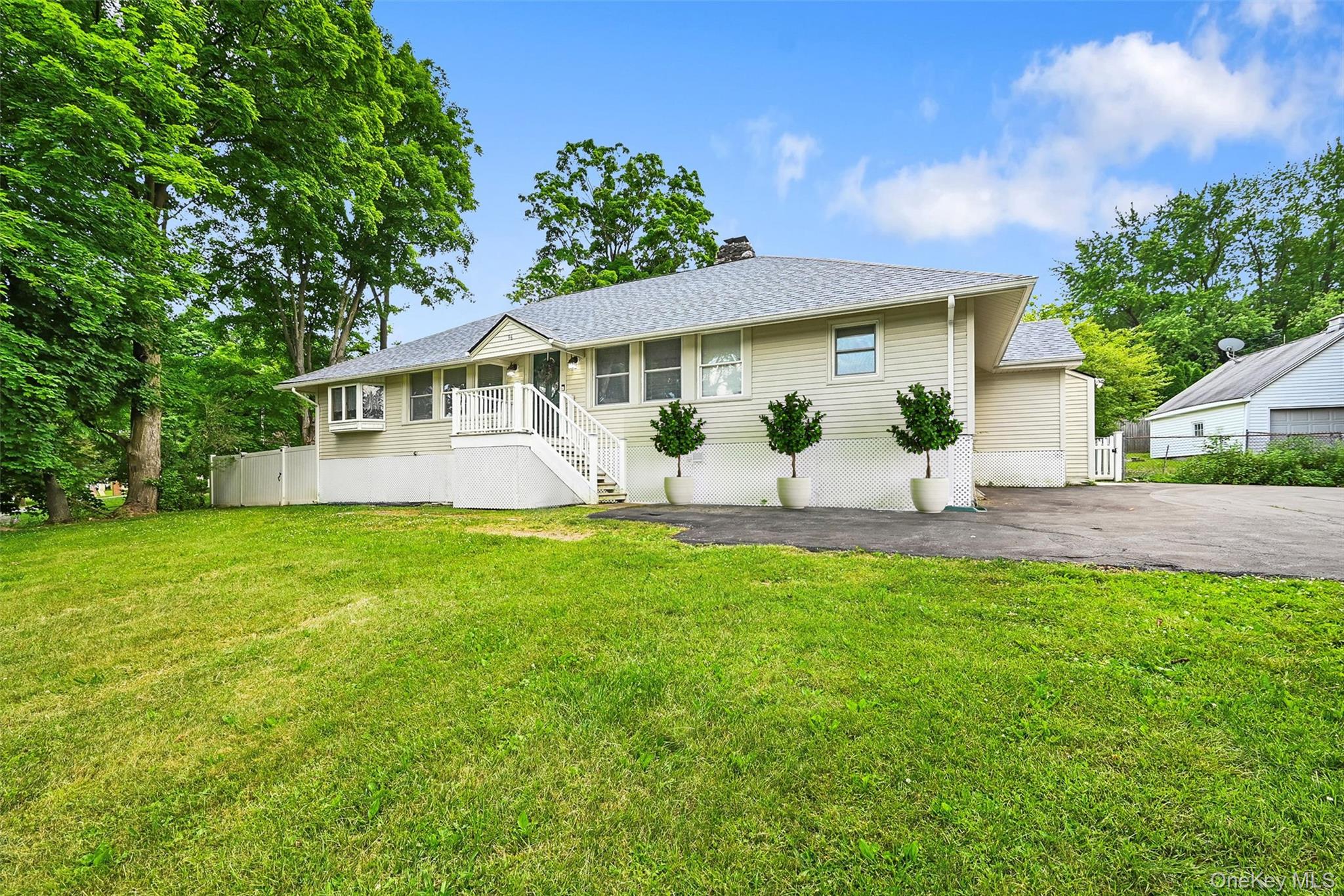 96 Galloway Road Warwick, NY 10990 - Photo 1 of 15 a front view of a house with a garden and plants
