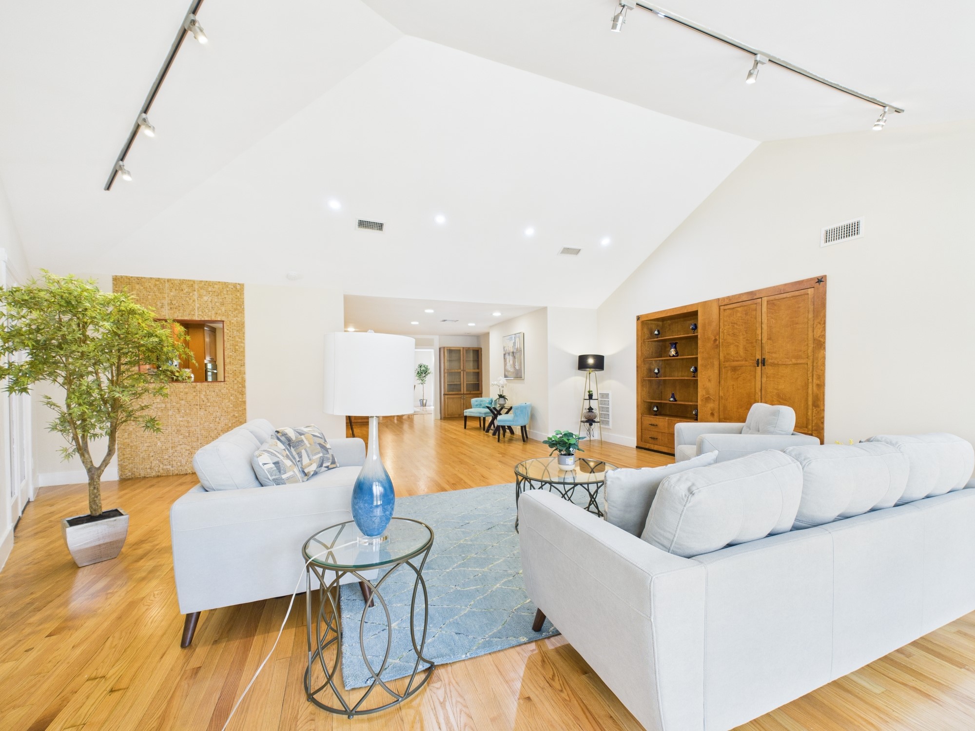 2432 Chimney Rock Road Houston, TX 77057 - Photo 15 of 43 a living room with furniture and wooden floor