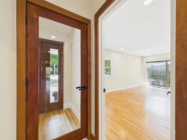 a view of a patio with a table and chairs under an umbrella