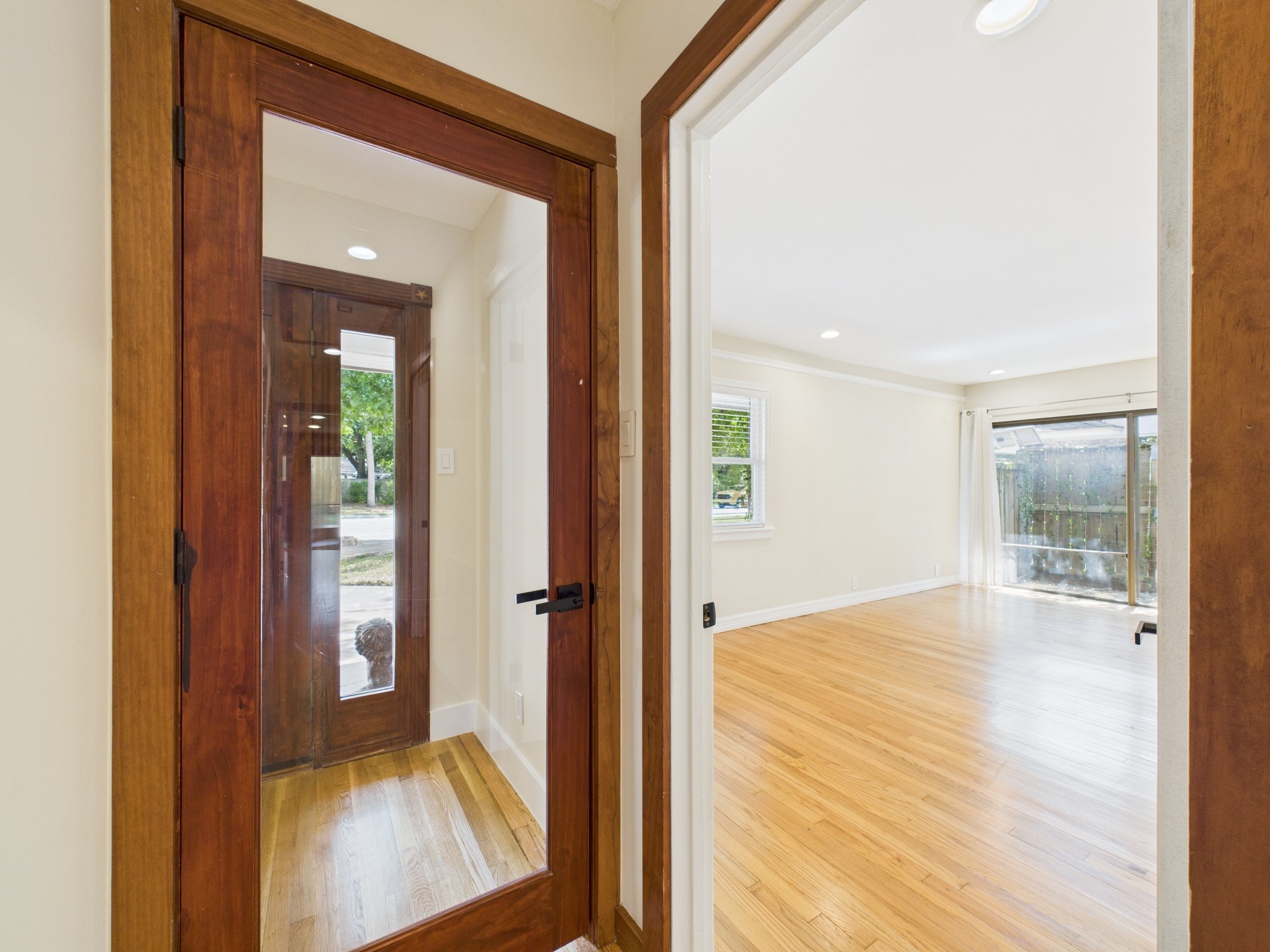 2432 Chimney Rock Road Houston, TX 77057 - Photo 21 of 43 a view of a hallway with wooden floor and a bathroom