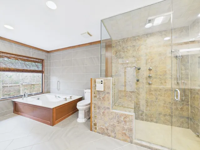 a bathroom with a granite countertop sink mirror and double