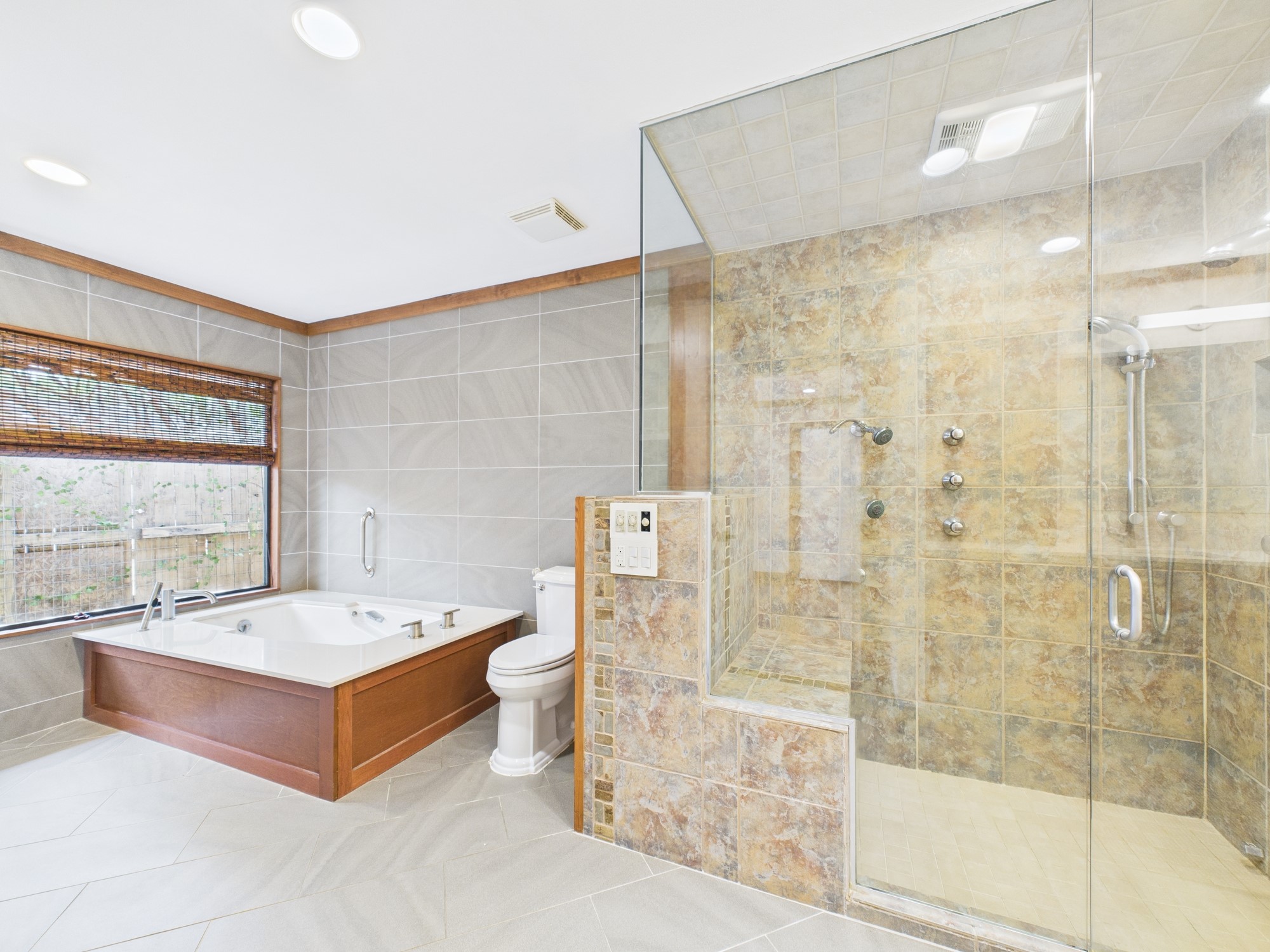 2432 Chimney Rock Road Houston, TX 77057 - Photo 28 of 43 a bathroom with a large tub shower and sink