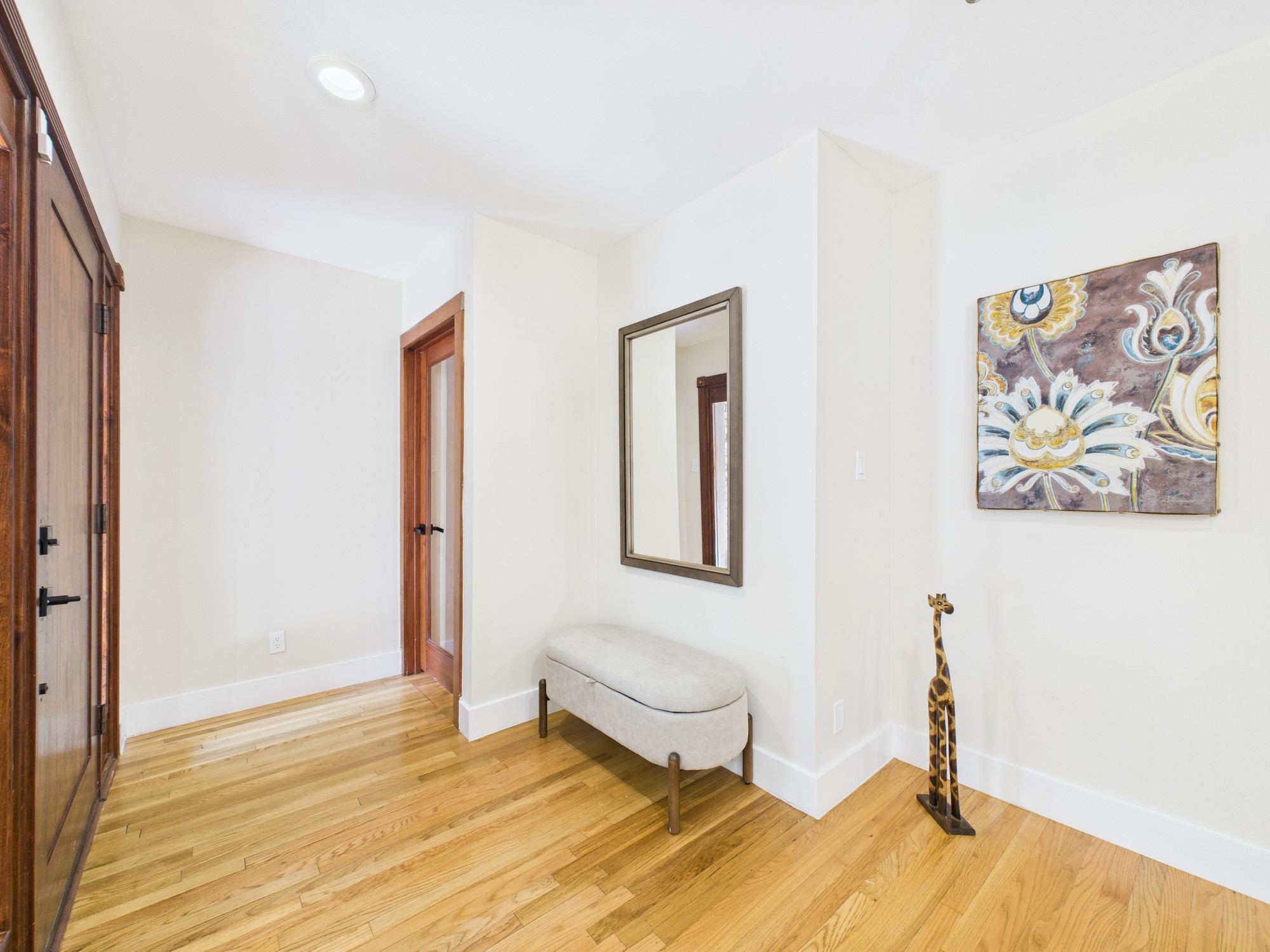 2432 Chimney Rock Road Houston, TX 77057 - Photo 2 of 43 a bedroom with a bed and a painting on the wall