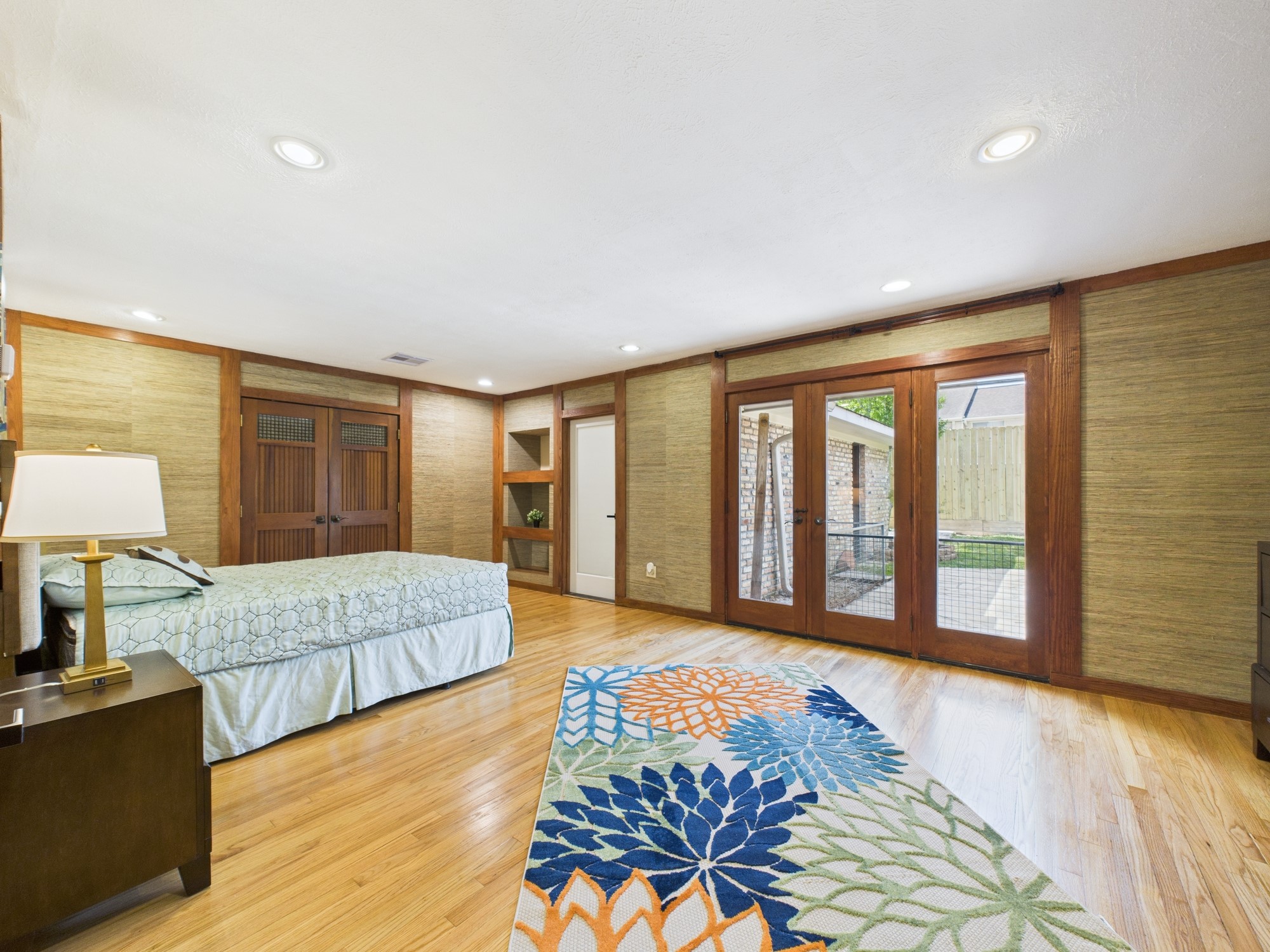 2432 Chimney Rock Road Houston, TX 77057 - Photo 30 of 43 a spacious bedroom with a large bed and a large window